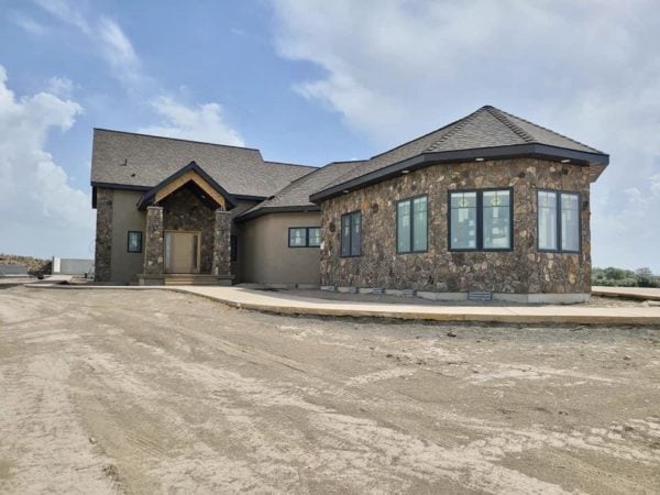 Front View of Home with Moss Rock Real Stone Veneer