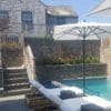 Outdoor Living Area with Pool and Cape Cod Natural Stone Veneer