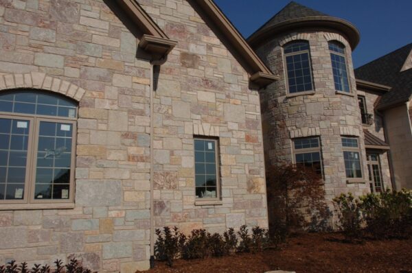 Home Exterior and Turret with Ravenna Limestone Thin Veneer