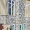 Home exterior with Chamberlain real thin stone veneer and tan mortar