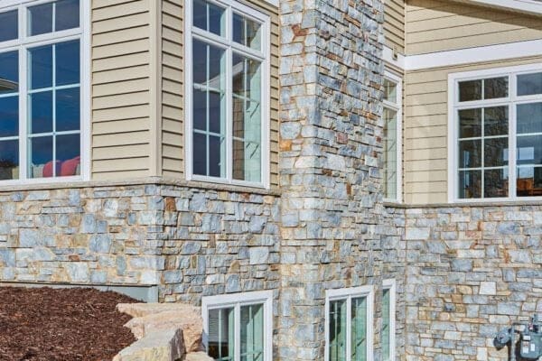 Home exterior with Chamberlain real thin stone veneer and tan mortar