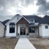 Curb view of home with Roanoke real stone veneer exterior accent walls