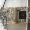 Interior gas fireplace with Whistler natural stone veneer