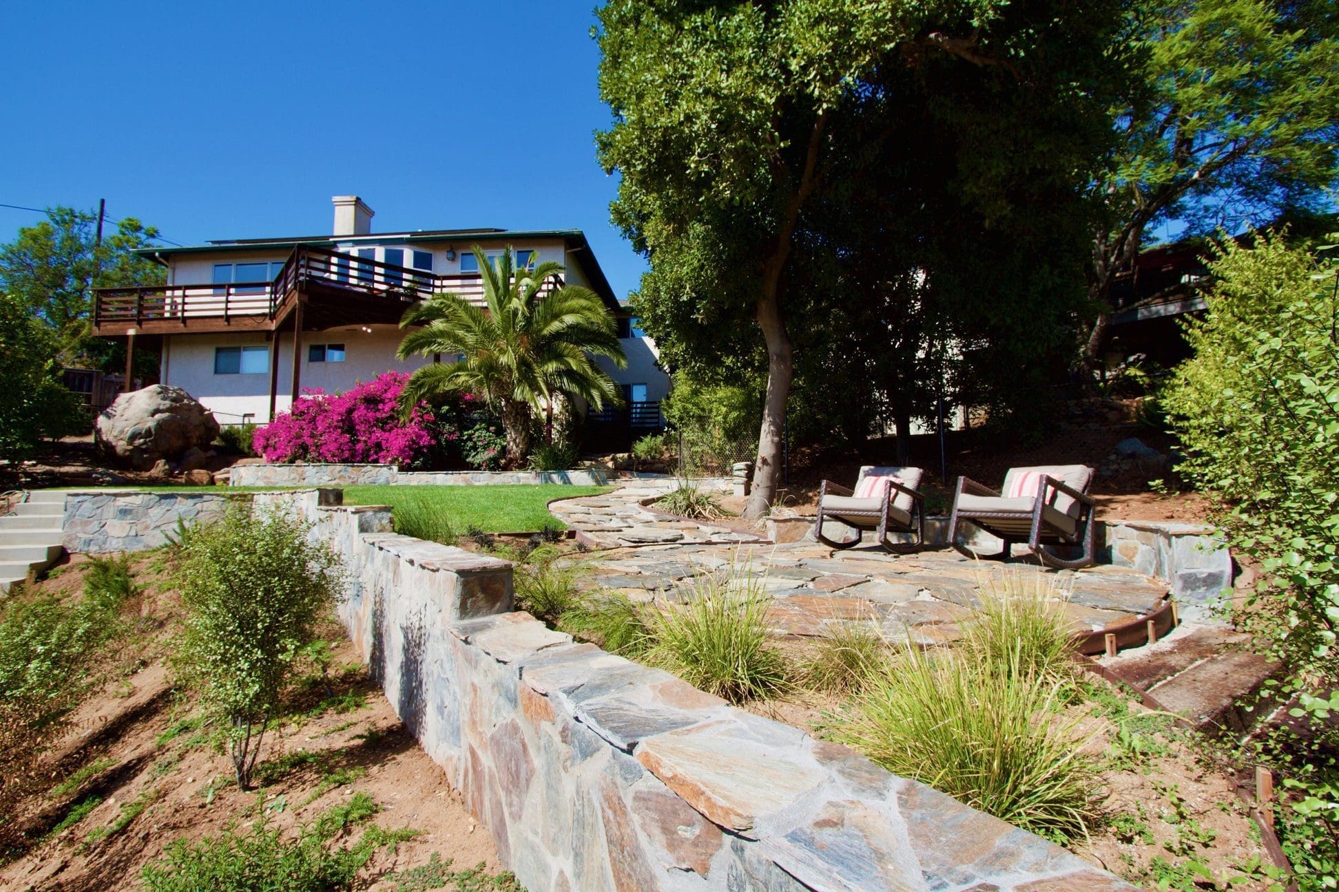 California backyard with Bonavista mosaic stone retaining wall and patio