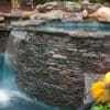 Pool and spa with Augusta real thin stone veneer drystack siding