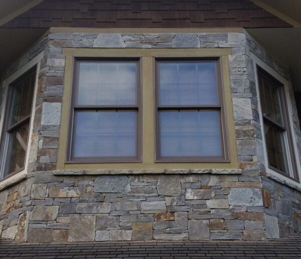 Home exterior with drystack Augusta and Bayside custom blend real stone veneer