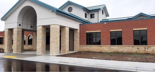 Commercial exterior with Ellison Bay natural thin stone veneer wainscoting and pillars