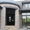 Round front entrance with Empire natural stone veneer