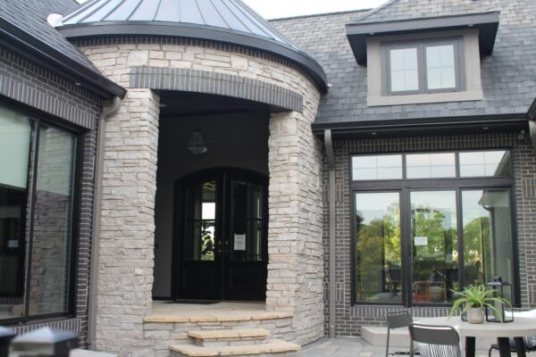 Round front entrance with Empire natural stone veneer