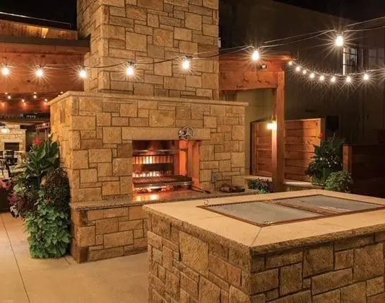 Outdoor patio and fireplace with Newcastle dimensional natural thin stone veneer
