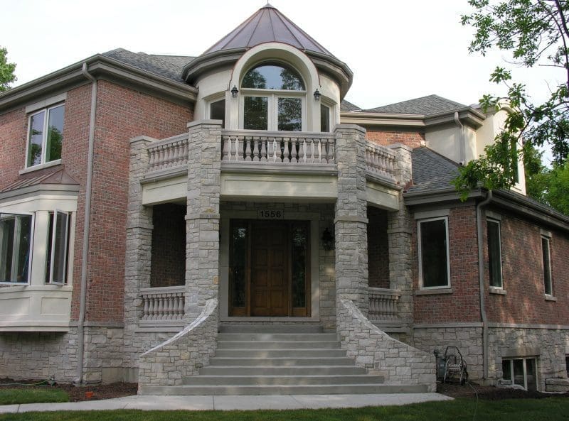 Front entrance with Promenade tumbled natural stone veneer