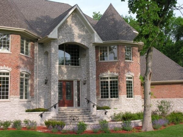 Exterior with Promenade tumbled real thin stone veneer