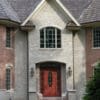 Front entrance accent wall with Promenade tumbled ashlar style real thin stone veneer