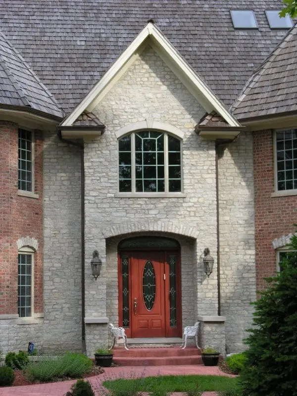 Front entrance accent wall with Promenade tumbled ashlar style real thin stone veneer