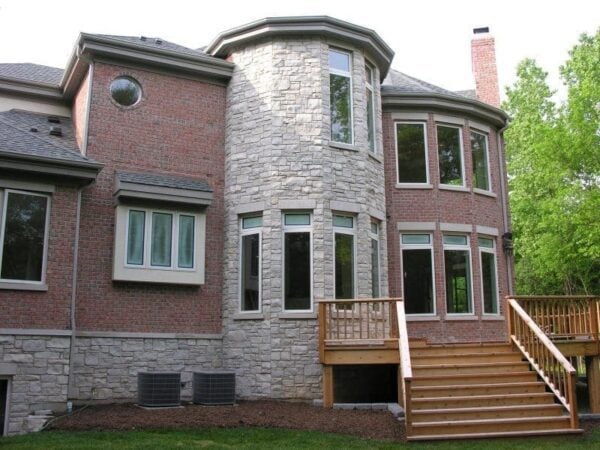 Backyard accent wall with Promenade tumbled natural thin stone veneer