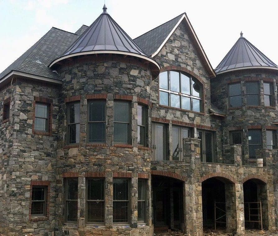 Home exterior with Richmond, Carlisle, and Shadow Vista natural stone veneer