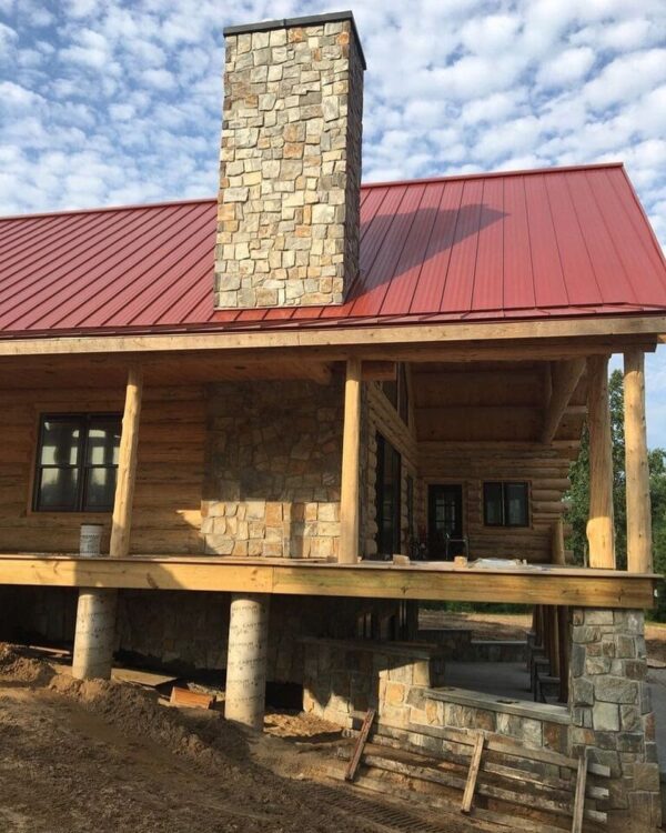 Log cabin siding with Rochester real thin stone veneer