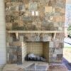 Outdoor fireplace with Rochester and Whistler natural stone veneer