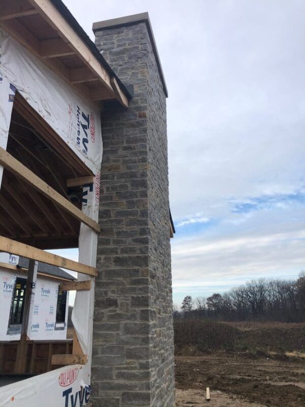 Chimney installation with Vineyard natural stone veneer