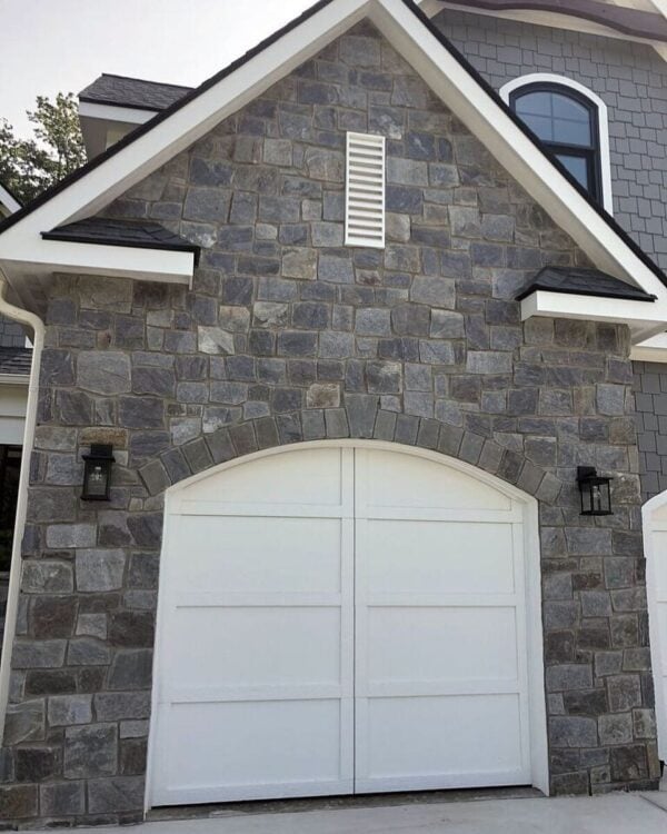 Garage siding with Berkley castle rock style real thin stone veneer