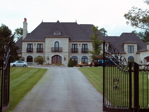 Custom La Spezia Natural Thin Stone Veneer Exterior with Gold Tones