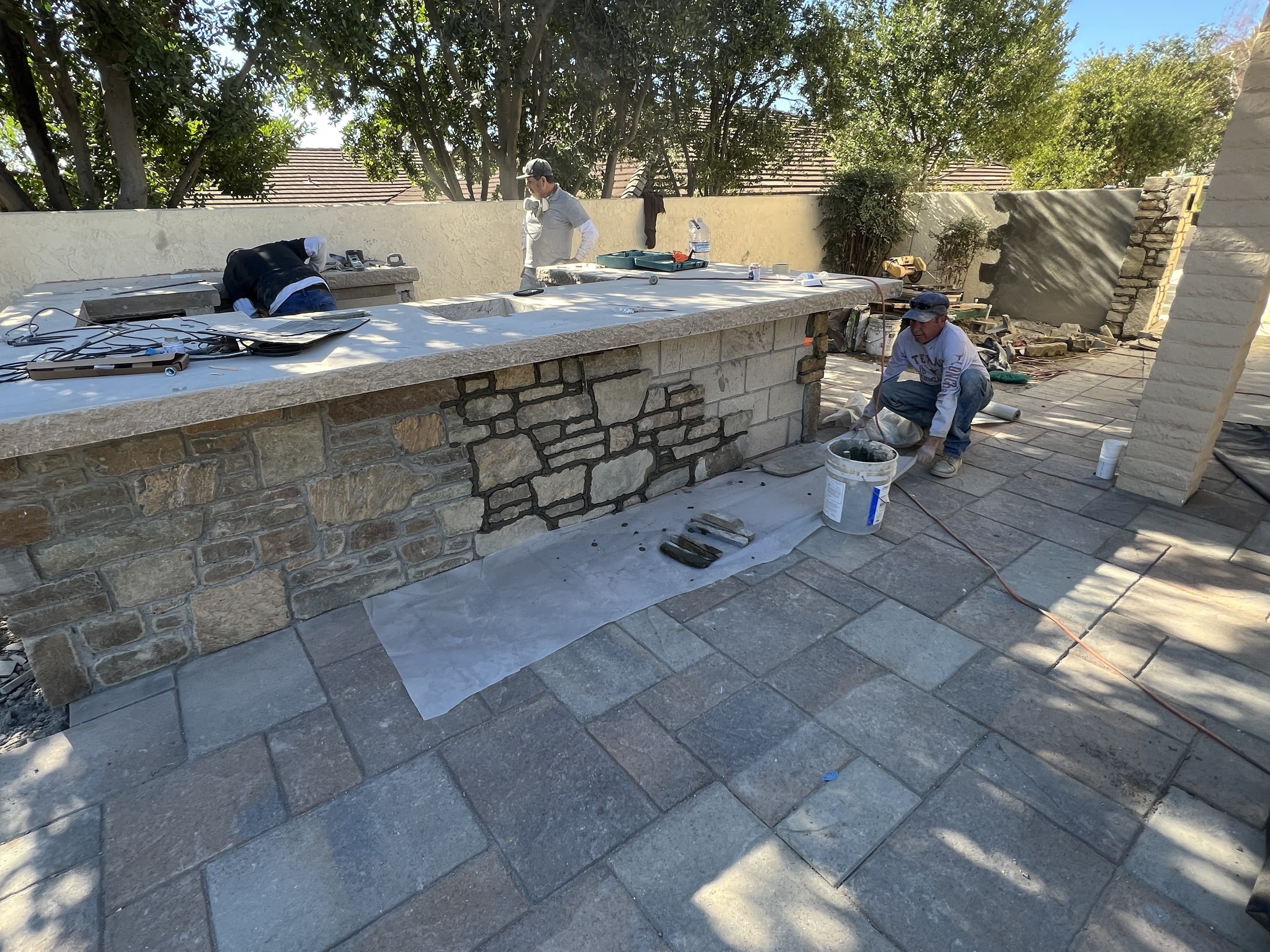 Installation in Progress of Cabernet Natural Stone Veneer to Outdoor Bar