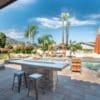 Outdoor Living Pool and Spa with Cabernet Real Thin Stone Veneer