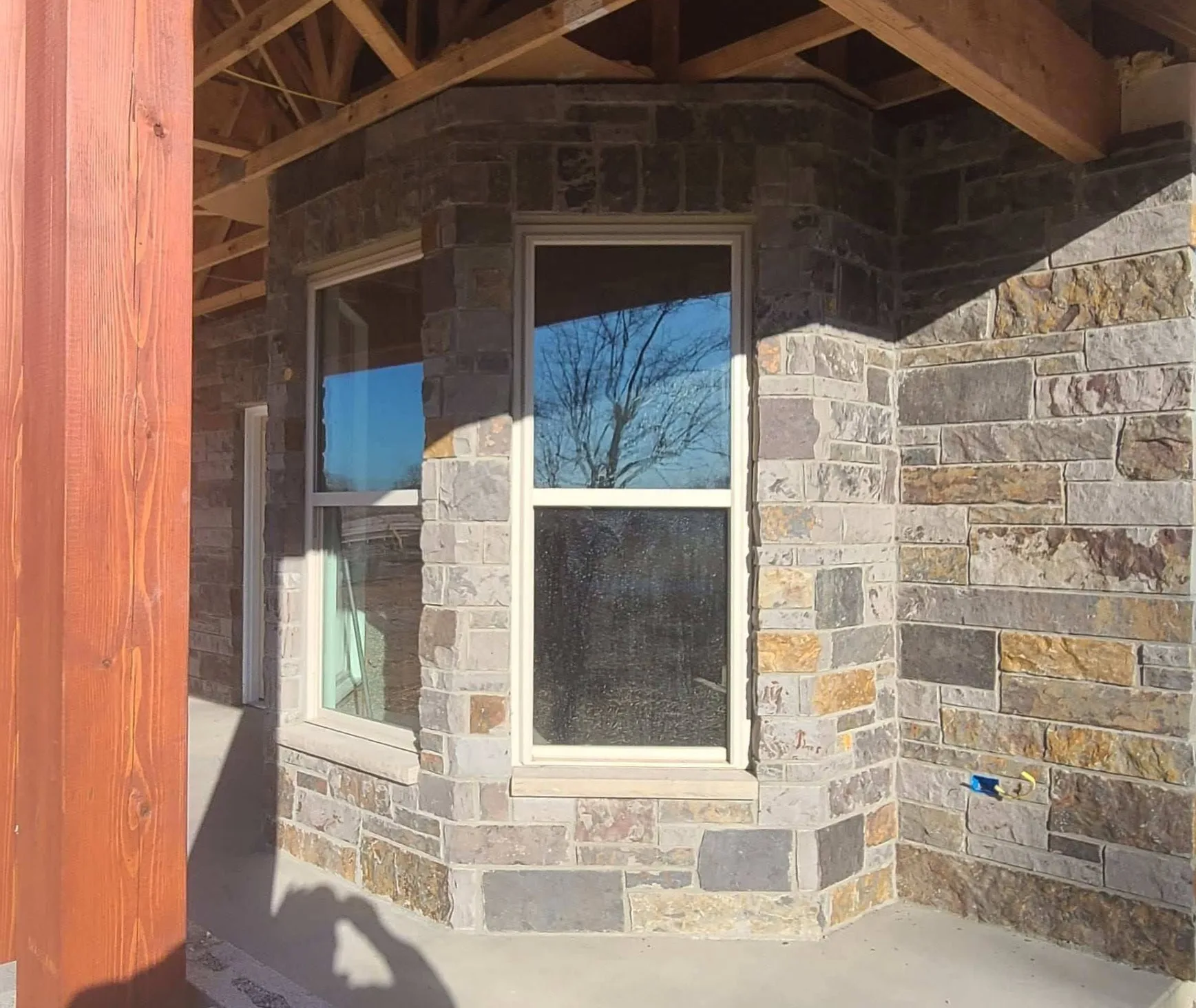 Custom Buckingham Natural Stone Veneer with Brown Patio