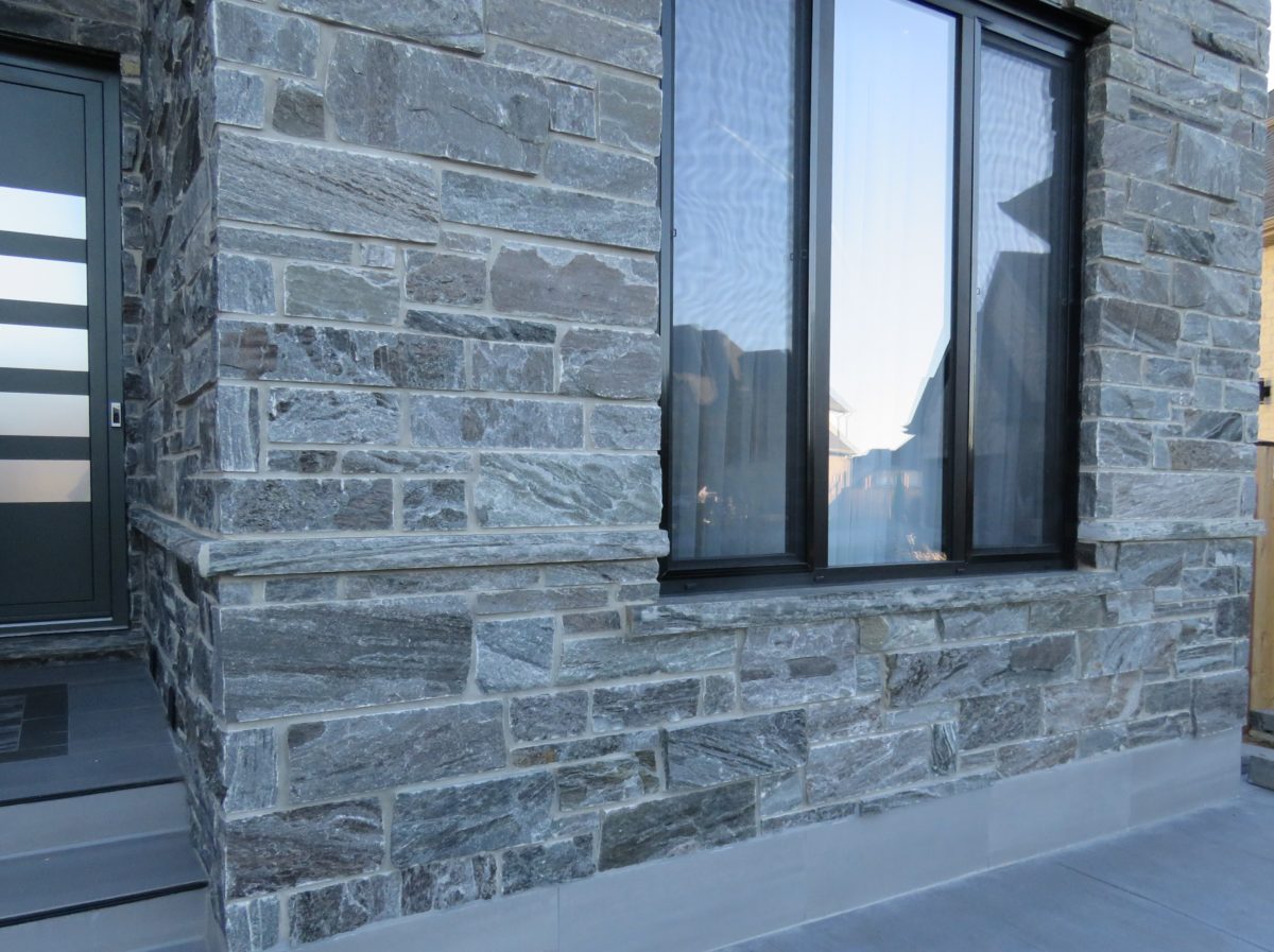 Split System Stone Home Exterior and Garage with Pembroke Real Thin Veneer | Quarry Mill