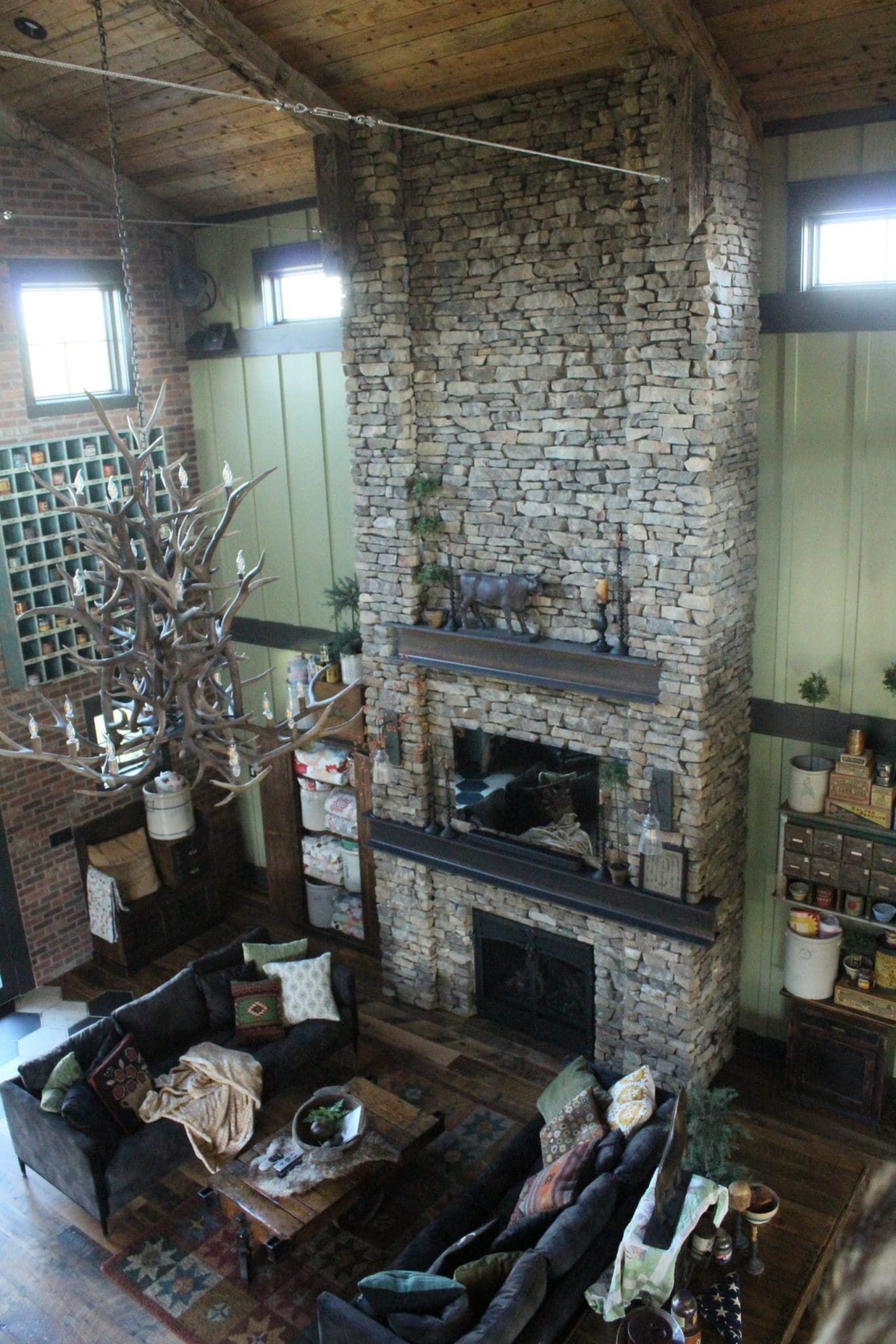 Great room fireplace with natural stone veneer fireplace