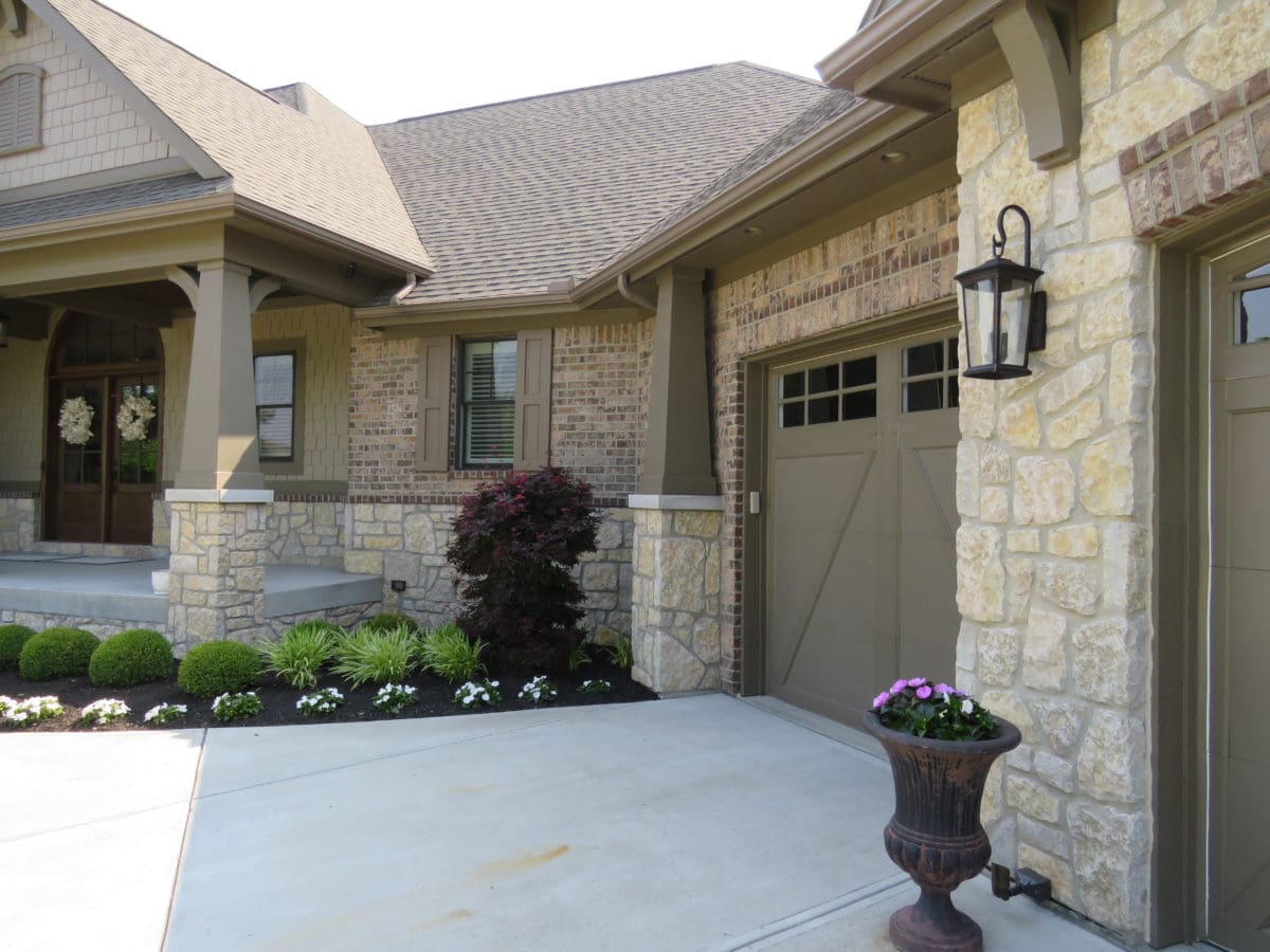 Chateau Real Stone Veneer Exterior, Wainscoting, and Garage | Quarry Mill