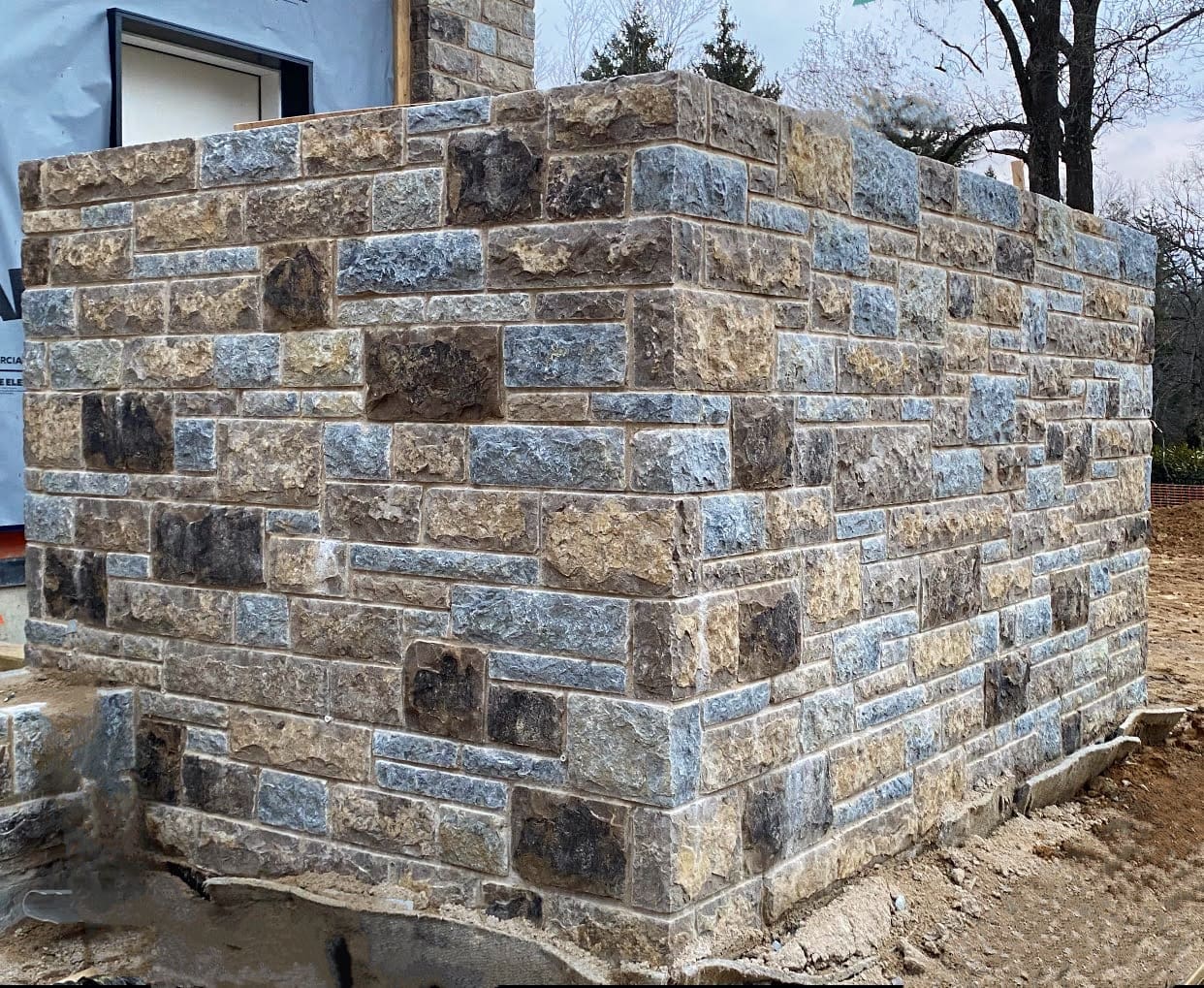 Jacksonport Custom Tumbled Natural Thin Stone Veneer Installation in Progress