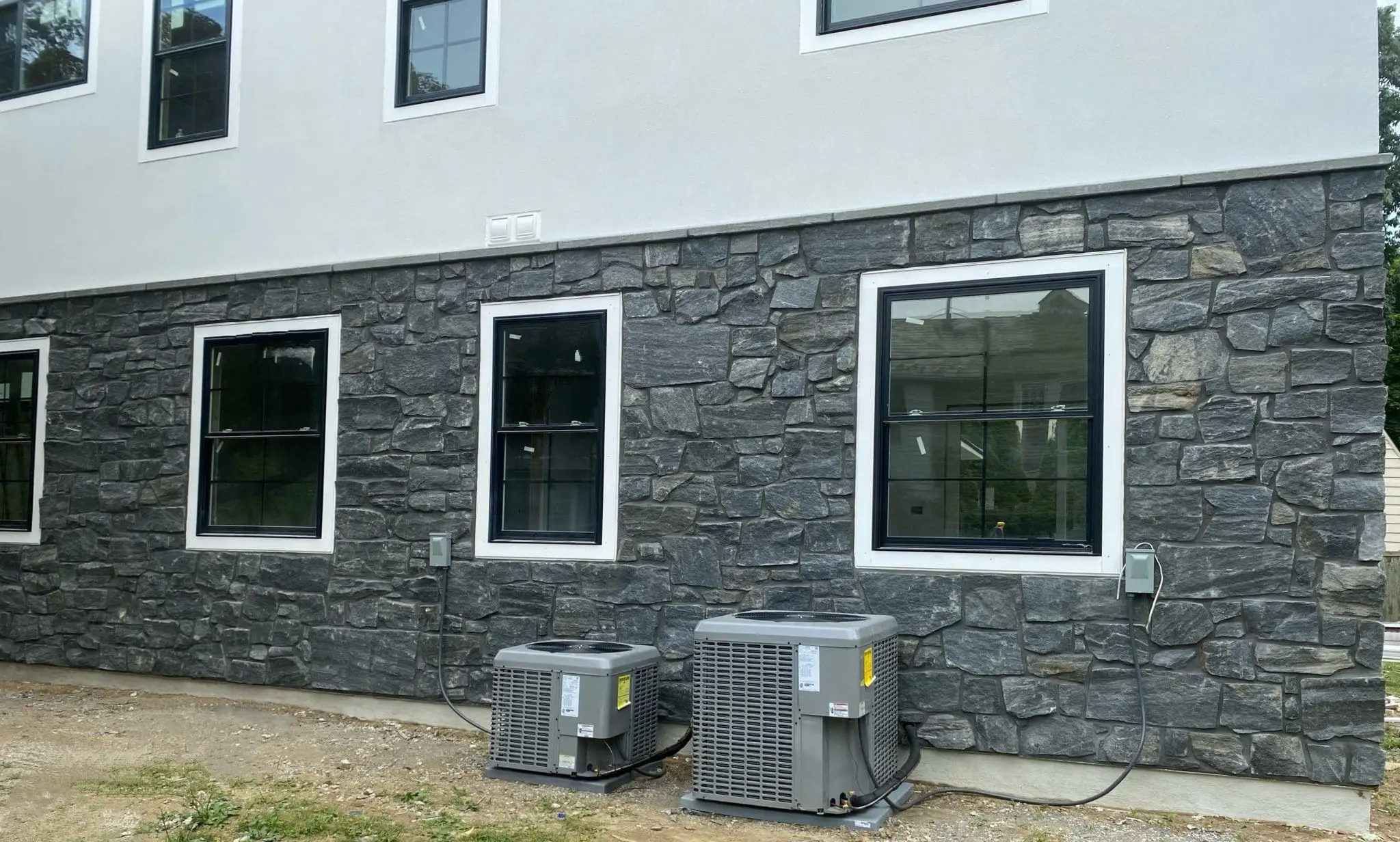 Monroe Natural Thin Stone Veneer Custom Dark Exterior with Black Mortar