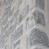 Duluth and Chateau Natural Thin Stone Veneer Blend Fireplace Close Up with White Mortar