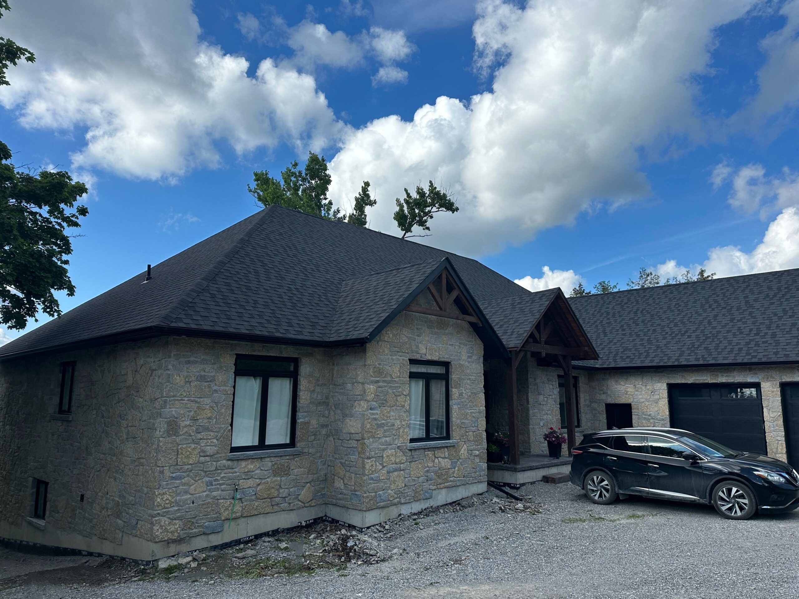 Chateau Real Thin Stone Veneer Lake House Front Install