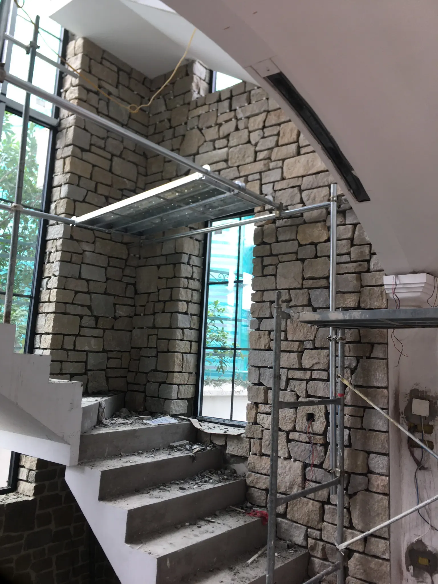 Tuscan Antique Natural Stone Veneer Stairwell Install