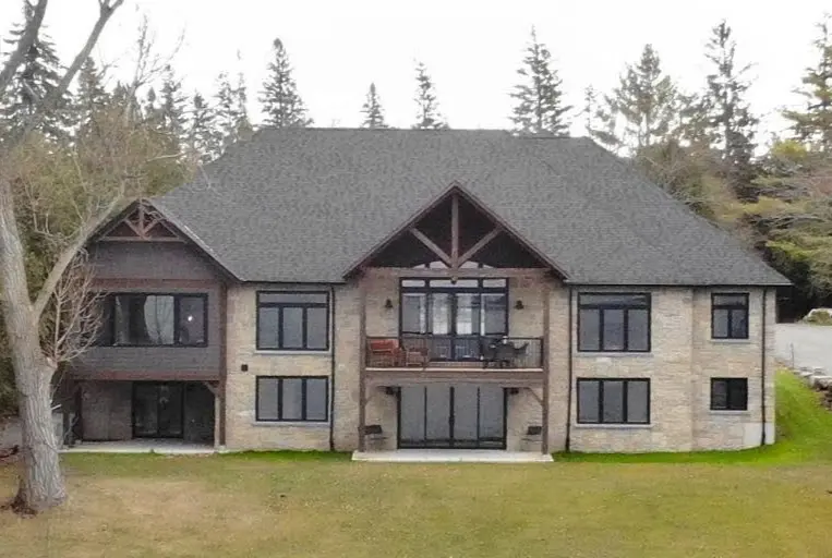 Chateau Natural Thin Stone Veneer Lake House Day