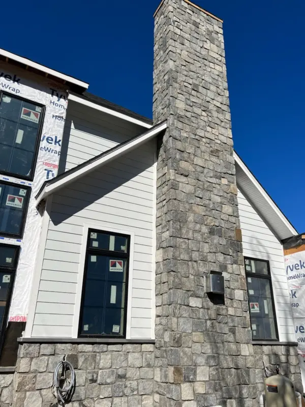 Custom Gallatin Natural Thin Stone Veneer Chimney and Wainscoting Installation