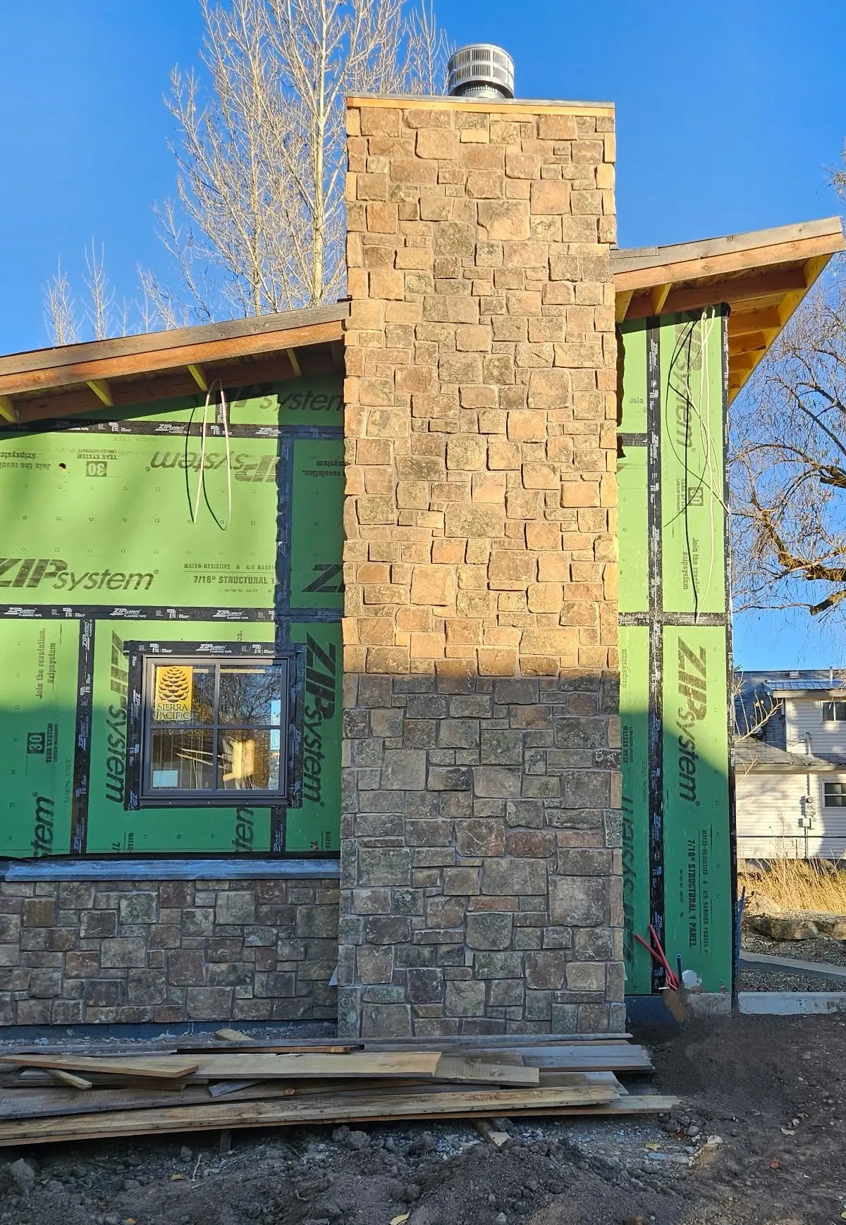 Spreewald Natural Thin Stone Veneer Chimney and Wainscoting Installation