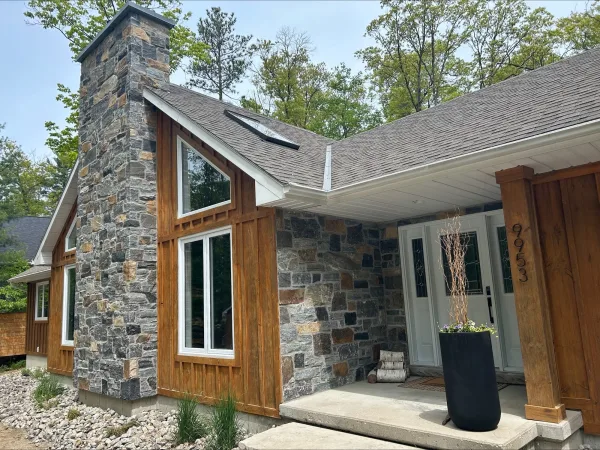Custom Logan Real Thin Stone Veneer with Dark Tones and Brown Chimney and Entrance
