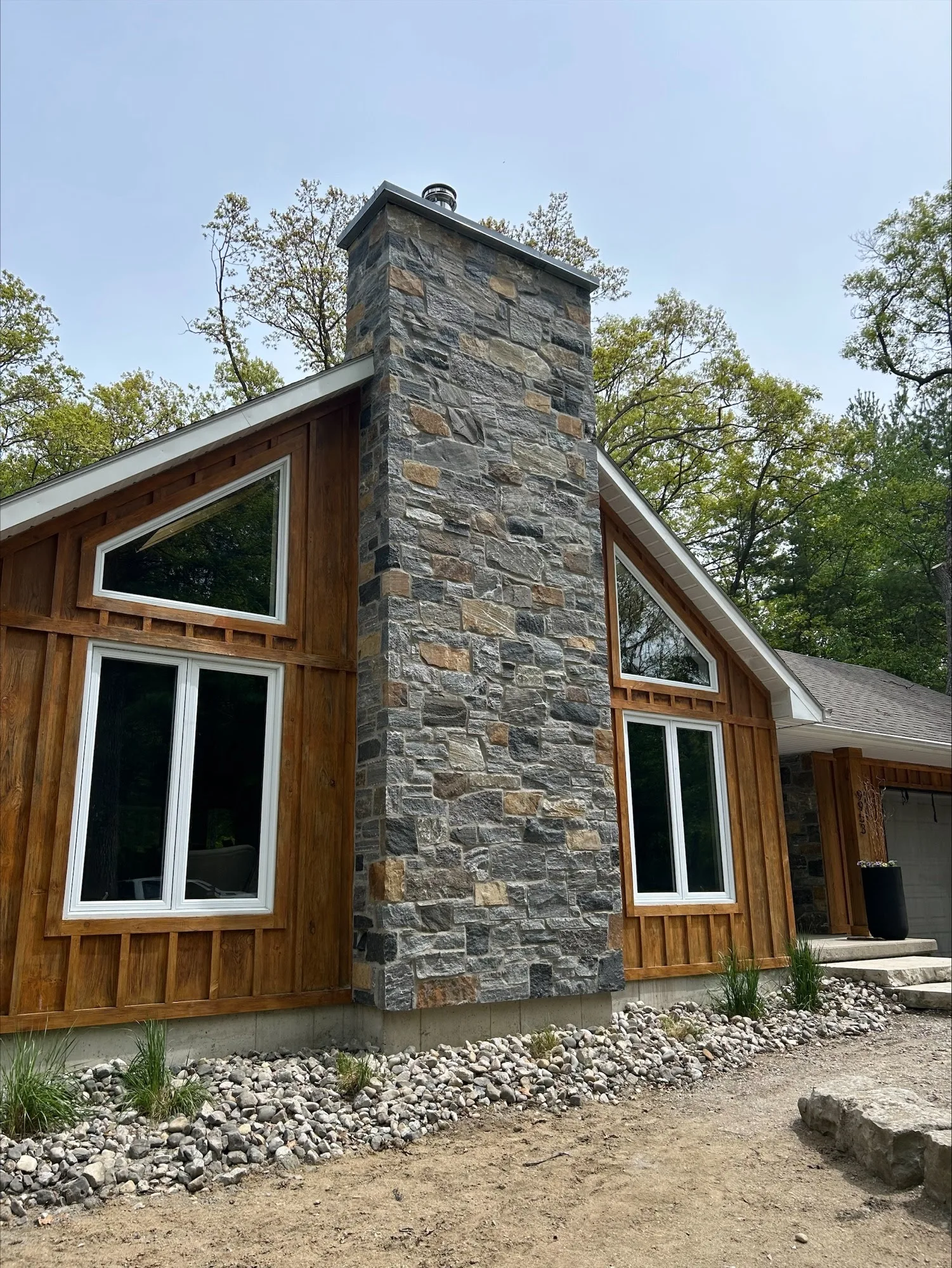 Custom Logan Real Thin Stone Veneer with Dark Tones and Brown Chimney