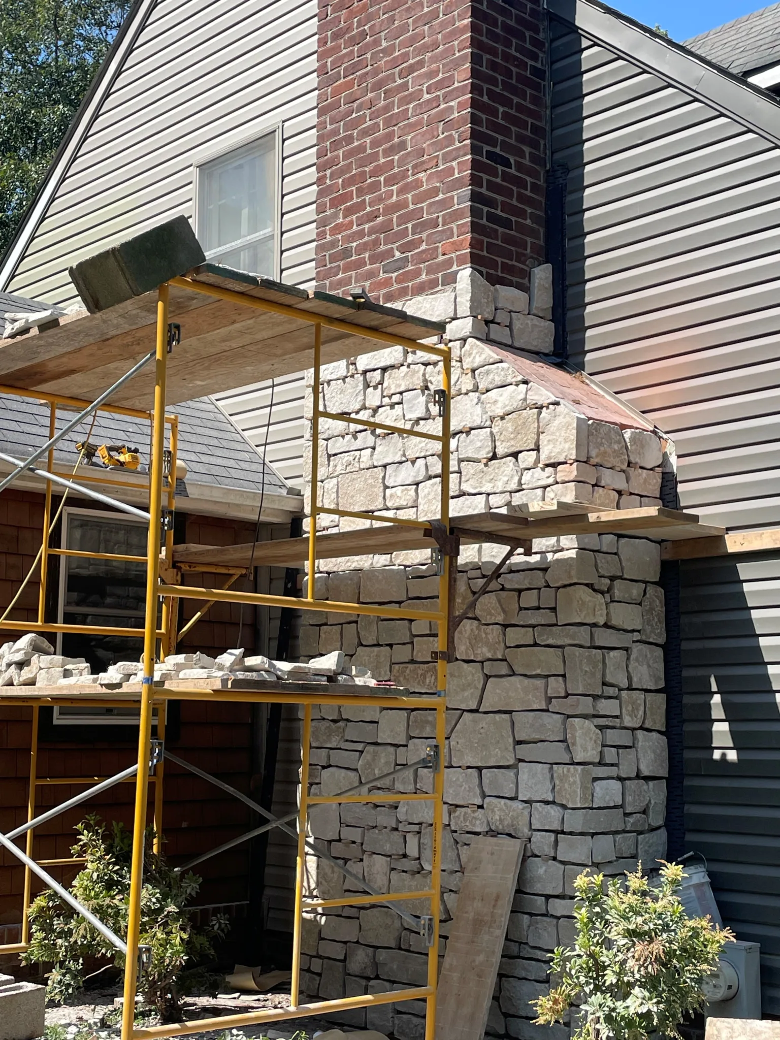 Lisbon Natural Thin Stone Veneer Chimney Renovation Installation